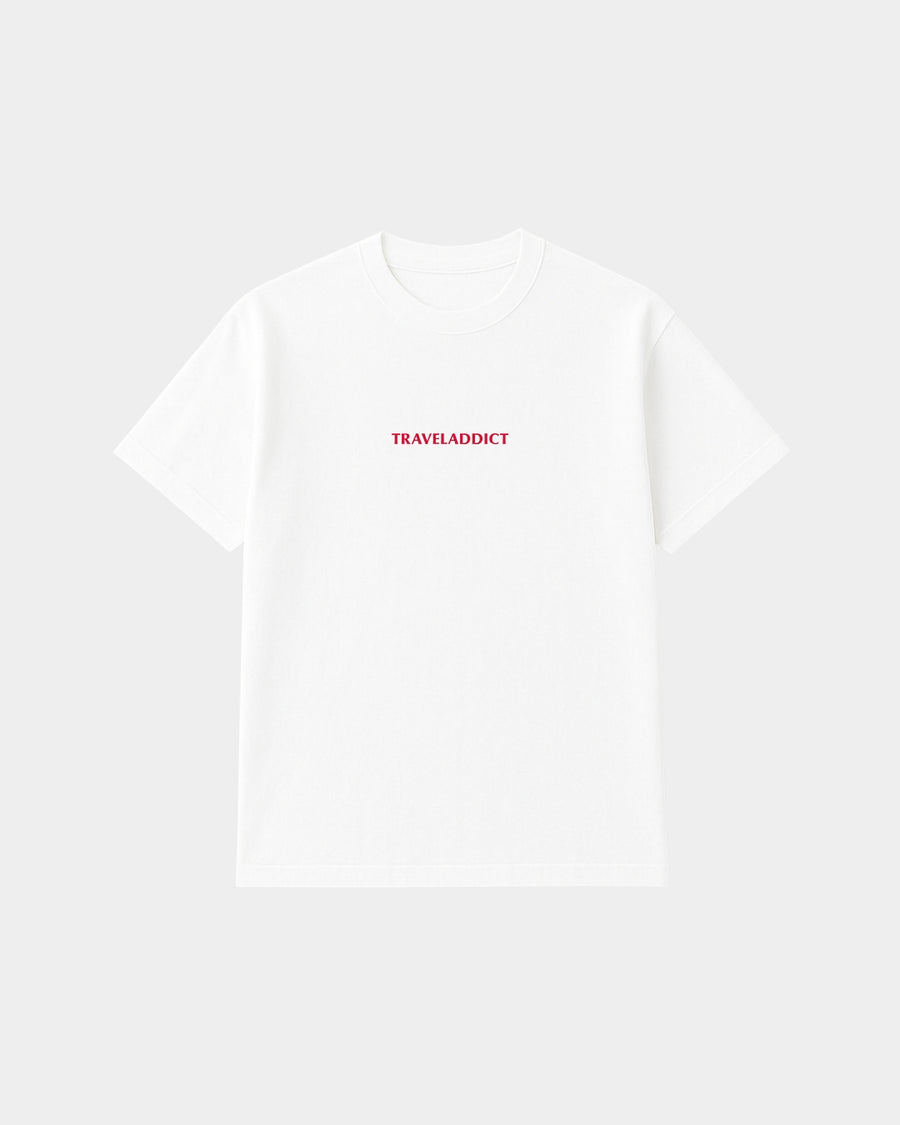 Wit bamboe T-shirt Traveladdict van Glint Antwerp met rood borduursel op de borst, unisex